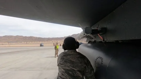 Ground crew removing remove before flight tags from fighter jet Stock Footage 105227273