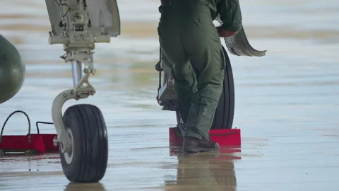 Ground crew securing landing gear of Eurofighter Typhoon Stock Footage 321953845