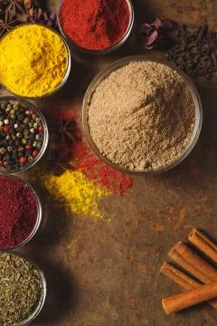 Ground Cumin . Place for text. Different types of Spices in a bowl on a stone Stock Photos