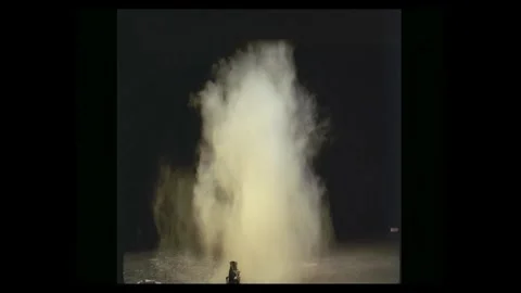 Ground Dirt Explosion and Shrapnel Compositing Element against Black Stock Footage 335384501