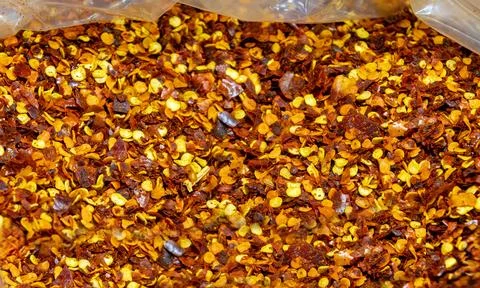 Ground dry paprika spice pattern background from dried and ground red peppers Stock Photos