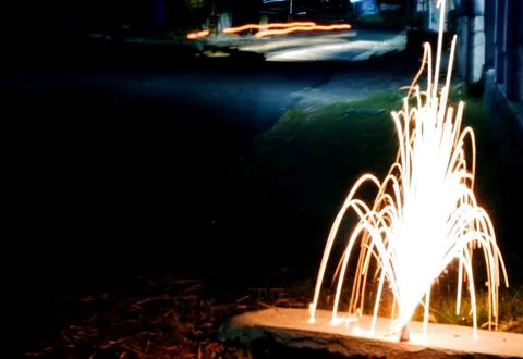 Ground Firework Fountain Shooting Bright Sparks at Night Stock Photos