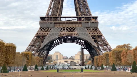 Ground floor and first floor of the Eiffel Tower in autumn in Paris, France Stock Footage 221864586