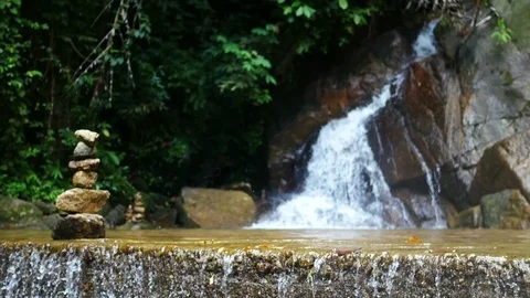 Ground floor with water flow , blur defocus clear cold waterfall flow into ro Stock Footage 95661153