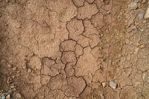 The ground has cracks in the top view for the background or graphic design .. Stock Photos