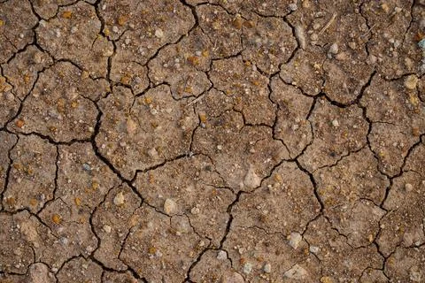 The ground has cracks in the top view for the background or graphic design .. Stock Photos