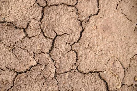 The ground has cracks in the top view for the background or graphic design .. Stock Photos