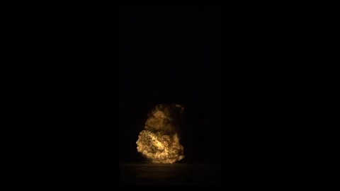 Ground Impact Tactical Fire Explosion Against Black Background Stock Footage 335911404