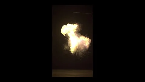 Ground Impact Tactical Fire Explosion Against Black Background Stock Footage 335911562