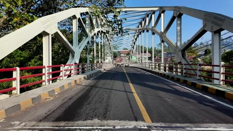 Ground Level Approach To White Steel Truss Bridge Stock Footage 345143823