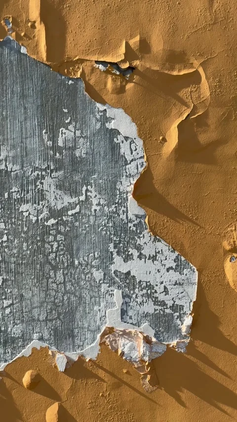 Ground level close shot highlighting cracked peeling wall texture at Camella Stock Footage 332961124