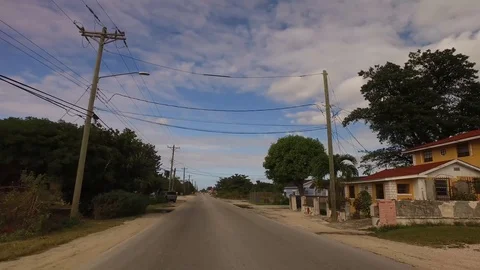 Ground-Level Drive Through Eight Mile Rock, Grand Bahama Island Stock Footage 99913517