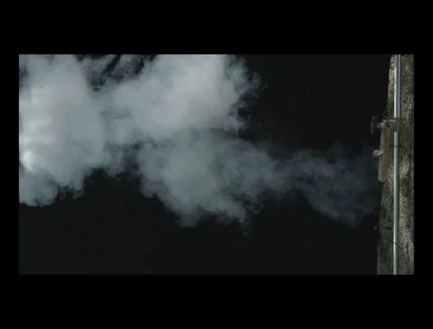 Ground Level Fire and Smoke Burst on Black Screen Stock Footage 335380333