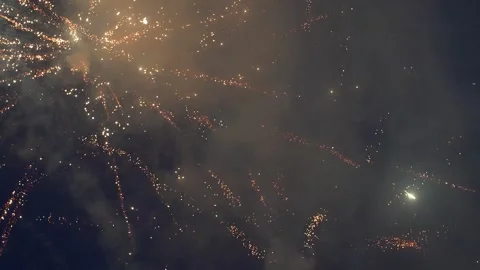 Ground Level Fireworks Bursting Through Smoky Night Sky Stockbeeldmateriaal 345835056