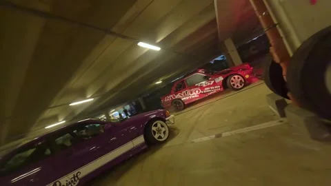 Ground-Level Launch: Red BMW vs Purple BMW Compact Drift Battle 스톡 동영상 327030603