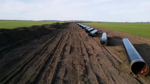 Ground-level perspective of steel pipes for the Balkan Stream gas pipeline in Bu Video stock 330901547