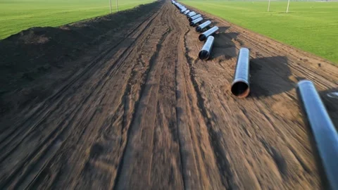 Ground-level perspective of steel pipes for the Balkan Stream gas pipeline in Bu Video stock 330901554