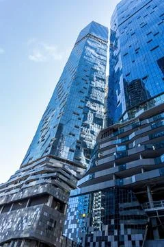 Ground level perspective view of a multistory modern high-rise building Stock Photos