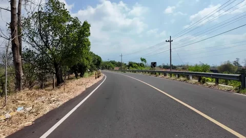 Ground Level POV Along Winding Rural Asphalt Road Stock Footage 345151719