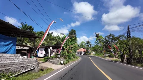 Ground Level POV Curving Road Through Pronojiwo Village Indonesia Stock Footage 345143560