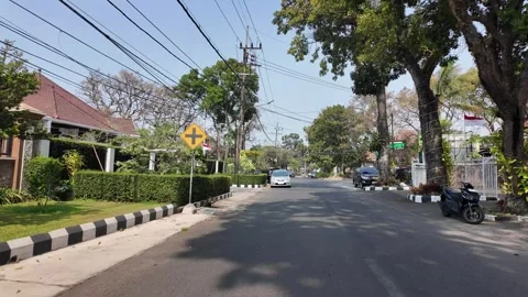 Ground Level POV Drive Through Malang Residential Street Stock Footage 345157234