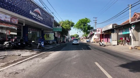 Ground Level POV Driving Through Indonesian Town Street Stock Footage 345151057