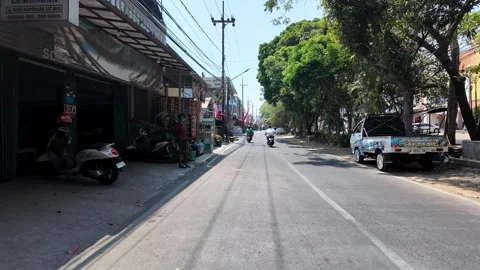 Ground Level POV Street Scene With Scooter Rider Stock Footage 345145853