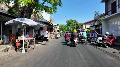 Ground Level POV Through Busy Probolinggo Market Road Stock Footage 345151185