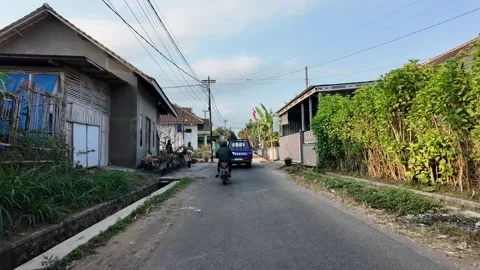 Ground Level POV Through Sumberpucung Village Street Scene Stock Footage 345158327