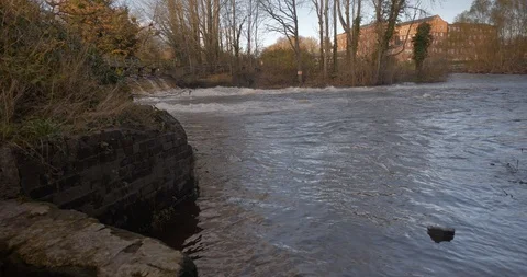 Ground level riverside next to weir with strong current Stock Footage 121154751