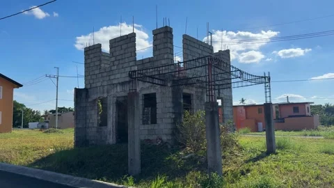 Ground level shot of a construction site beside completed houses, highlighting Stock Footage 332600256