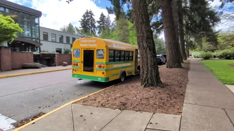 Ground-level video of a yellow mobile studio bus parked Video stock 344330447