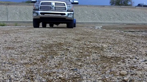 A ground-level view of approaching truck tires Stock Footage 78250950