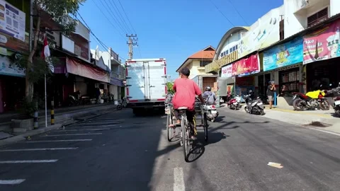 Ground Level View Behind Pedicab On Probolinggo Street Stock-Footage 345139009