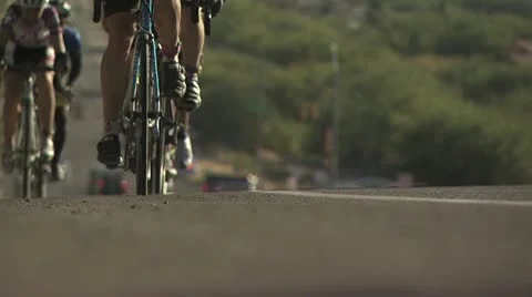 Ground Level View of Cyclists In A Road Race 스톡 동영상 19140672