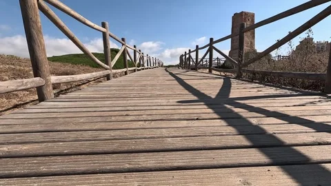 Ground level view footpath next to ancient tower Stock Footage 283865669