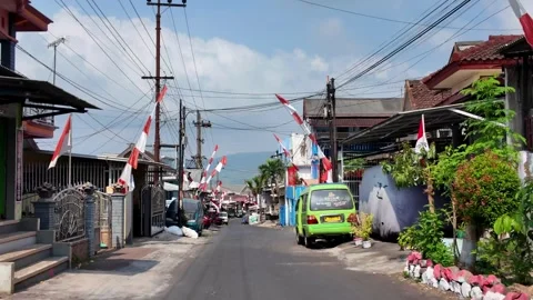Ground Level View Of Lawang Road Lined With Indonesian Flags Stock Footage 345200326