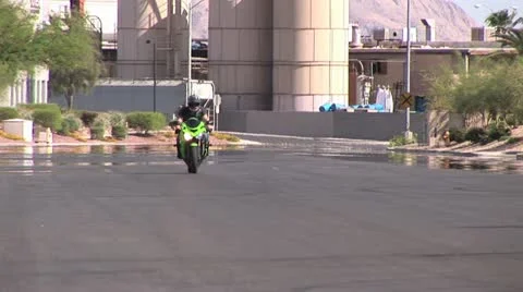 Ground Level View Of a Rider Doing A Back Tire Wheelie 3 Stock-Footage 18972492
