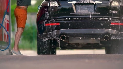Ground level view of soapy water on a car Video stock 110817344