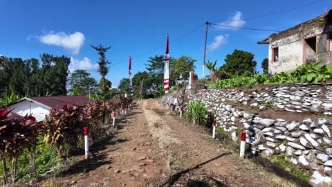 Ground Level View of Terraced Village Pathway in Lumajang Stock Footage 345196539