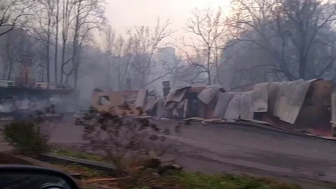Ground level view of urban area destroyed by wildfire near Gatlinburg, Tennessee Stock Footage 84329411