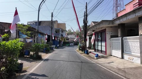 Ground Level View of Winding Malang Residential Street Stock Footage 345145662