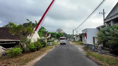 Ground Level View of Wonosari Village Street Flags Stock Footage 345201063