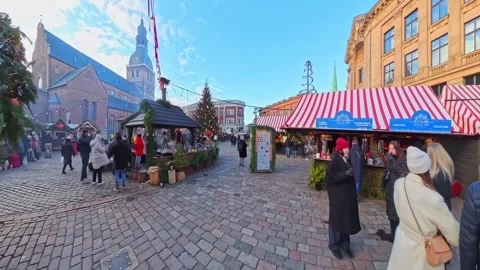 Ground-level walk through Europe Riga Christmas Market at Dome Square, passing Stock Footage 326577756