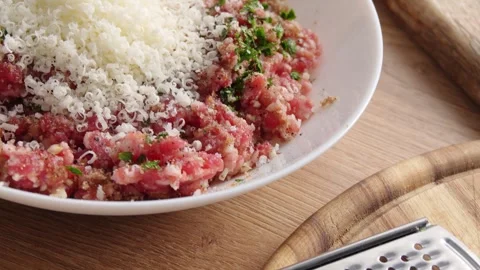 Ground Meat with Herbs and Grated Cheese. Stock Footage 256243057