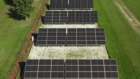 Ground mounted solar panel array generates clean electricity for rural business Video stock 346281111