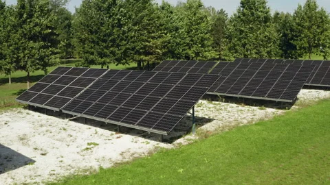 Ground mounted solar panels generate renewable green electricity for rural farm Video stock 346281171