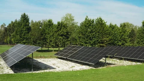 Ground mounted solar panels generate clean electricity for rural business Video stock 346281204