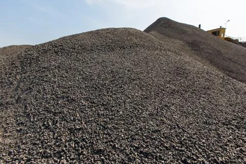 Ground natural stone poured into a large pile in a quarry Stock Photos