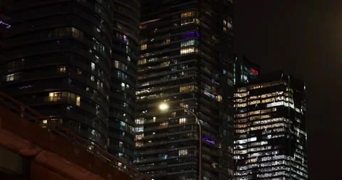 Ground-up night view of high-rise towers along Queens Quay West, Toronto, ON  Video stock 327731247